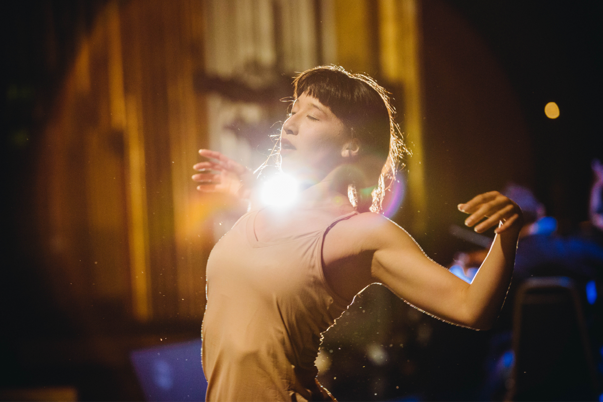 A dancer performs on stage.