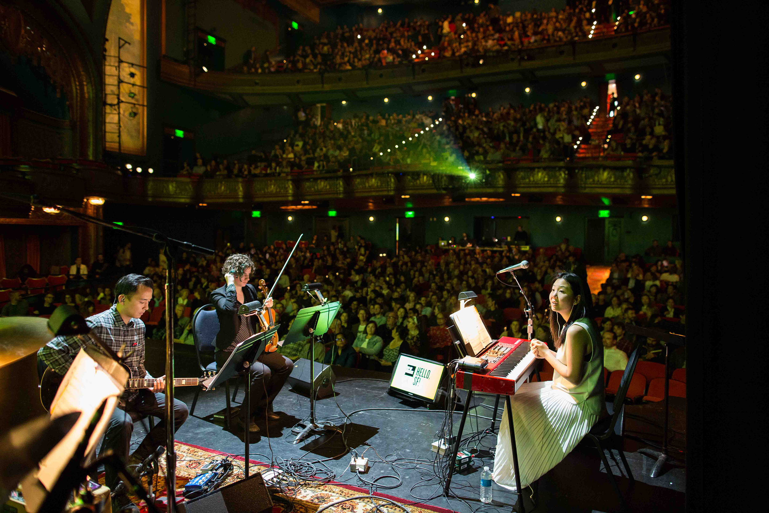 Magik*Magik Orchestra performs in front of a live audience.