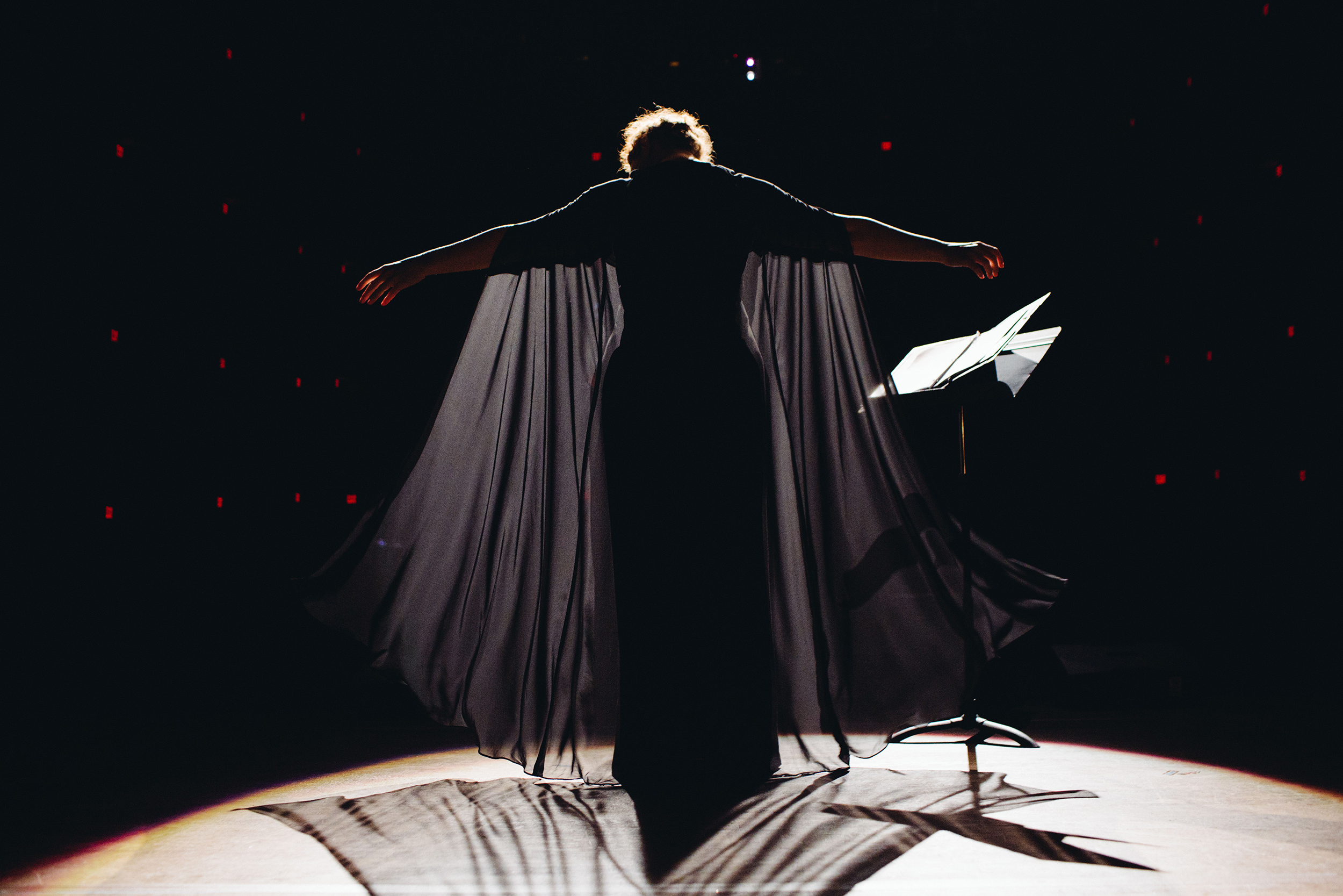 A performer takes a bow on stage.